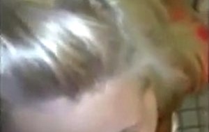 Blonde girl sucking cock at public toilet