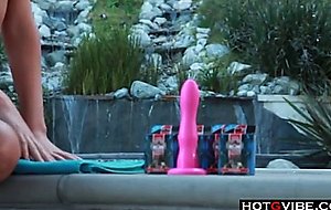 Big titted blonde gives herself orgasms by the pool