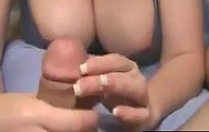 Busty chick gives a handjob