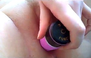 Shaved chick fucking her holes