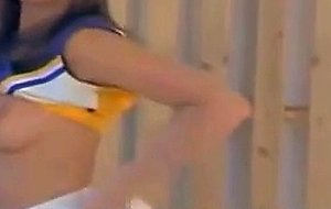 Cheerleader strips and fingers her pussy