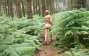 Sexy girl strips during nature walk  