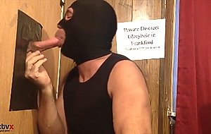 Worshipping a big cock at the gloryhole