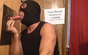 Worshipping a big cock at the gloryhole
