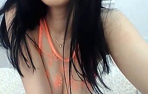 Asian Seductress Unveils Her Full Round Boobies