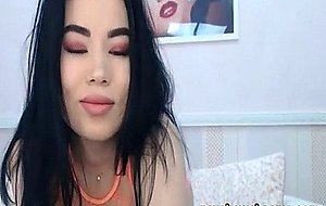 Asian Seductress Unveils Her Full Round Boobies