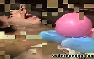 In a cold lonely factory a young bondage slut is ...