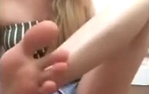 Amateur blonde teen worships her feet and licks her toes
