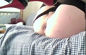 Crossdresser in purple inserts a giant vibrator