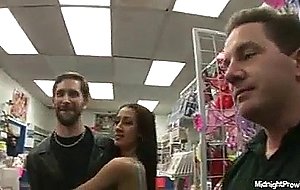 Girls doing orgy in a porno store