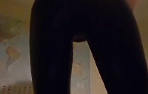 Crossdresser in shiny leggings tease