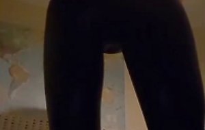 Crossdresser in shiny leggings tease
