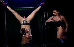 Unmerciful mistress suspends her female slave upside down and delivers ...
