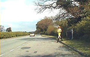 Transgender in yellow dress on the road