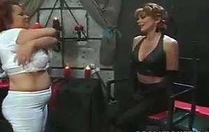 A cruel lady binds her girl slave's tits
