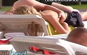 (voyeur cam) grabbing her tits at the swimmingpool