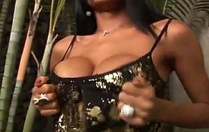 Black and busty shemale slut rubs one out