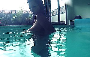 Holly gets nude in the pool