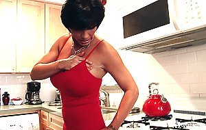 Busty MILF shows off while in pantyhose