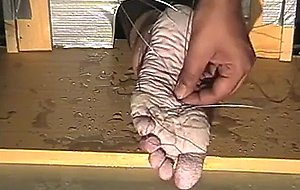 Tortured feet with wire  