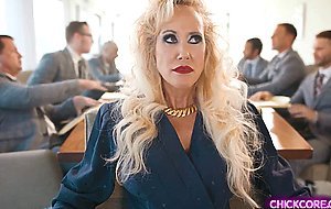 Two mature businesswomen have lesbian sex in office