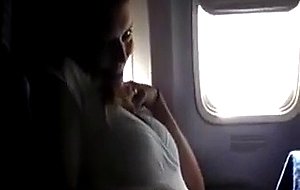 Masturbating her pussy in the airplane - free porn