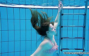 Sexy girl shows magnificent young body underwater