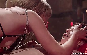 Busty redhead gets whipped in bondage