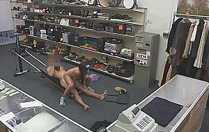 Muscled up black slut getting drilled at a pawn shop