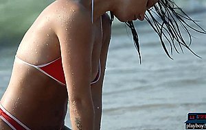 German MILF model Joelina strips naked on the beach