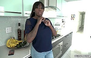 Ebony stepmom Mystique jiggling her huge tits in front of her stepsons face