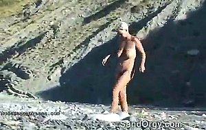 Floppy tits pussy spying at naked beach