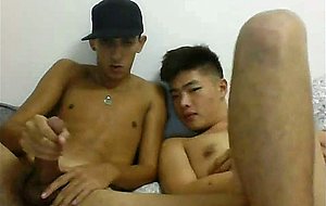 Asian twink blowing his honey friend