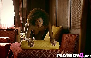 Curly black model spread her sweet legs and shows pussy