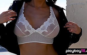 Bombastic latina babe presenting her massive fake boobs outdoor