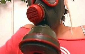 Gas mask wearing euro german slut masturbates in the toilet