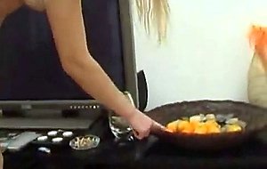 Sexy blonde shoves an orange in her ass