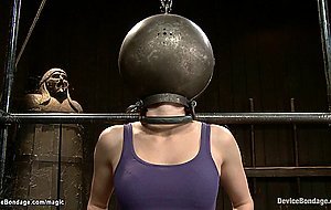 Bound redhead with head in metal ball