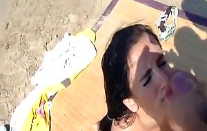 Teen facial on public beach