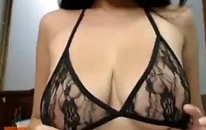 Busty asian babe stripping