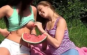 Coming out, honey girls eating watermelon outdoor