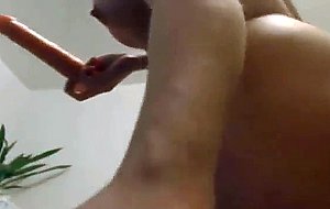 Horny babe strokes her vibrator upclose