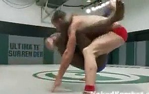 Two heavyweight fighters slam each other into the mat in ...