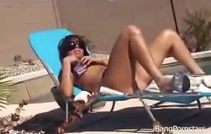 Horny pornstar Britney seductively poses on cam while sunbathing