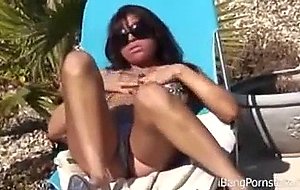 Horny pornstar Britney seductively poses on cam while sunbathing