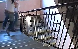 Gorgeous lesbians toying in a hallway