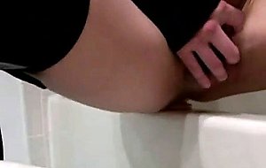Sexy crossdresser plays with a huge vibrator in the bath tub