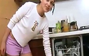 Innocent schoolgirl in a kitchen