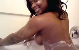 Bootylicious black teen taking a shower