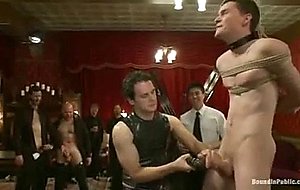 Partygoers beat and skull fuck a big dick stud in bondage.